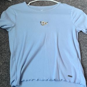 Blue crop top with flowers in center